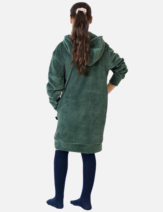 Back view of a young girl wearing a dark green velvet dress, the relaxed fit and hood detail offer a comfortable and stylish outfit for children.