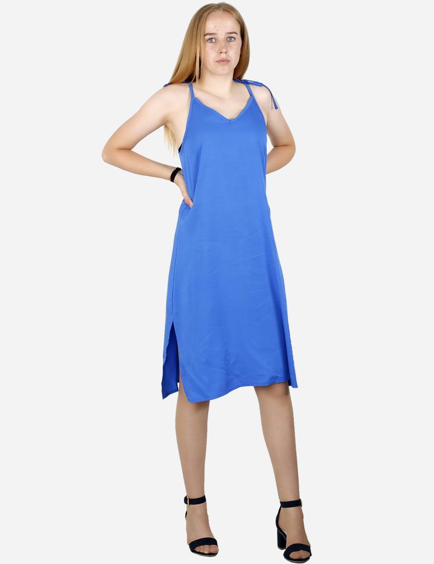 Back view of a stylish royal blue dress with tie-up straps on a young woman, isolated on white background.