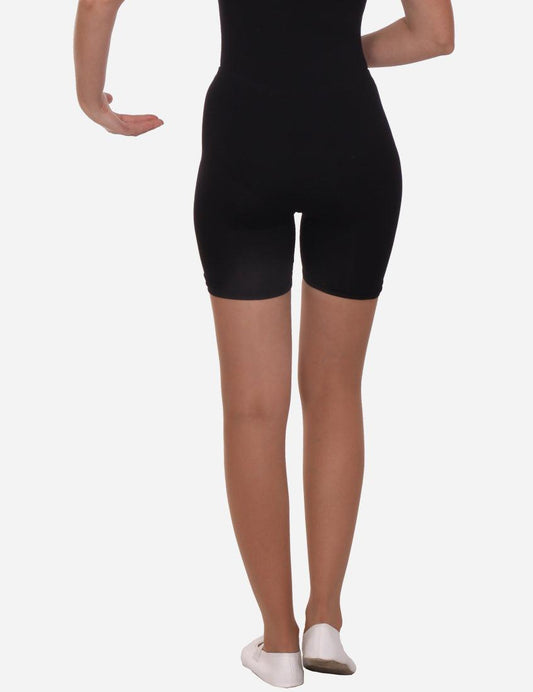 Side view of a woman demonstrating black, knee-length stretchy shorts suitable for active leisure.