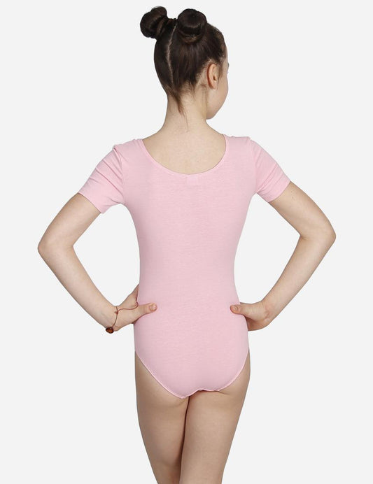 Back view of a child dancer in a pink short-sleeved leotard with ballet hairdo