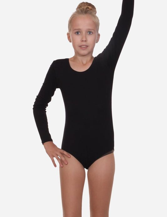 Child gymnast in a black long-sleeve leotard performing a ballet position, white background.