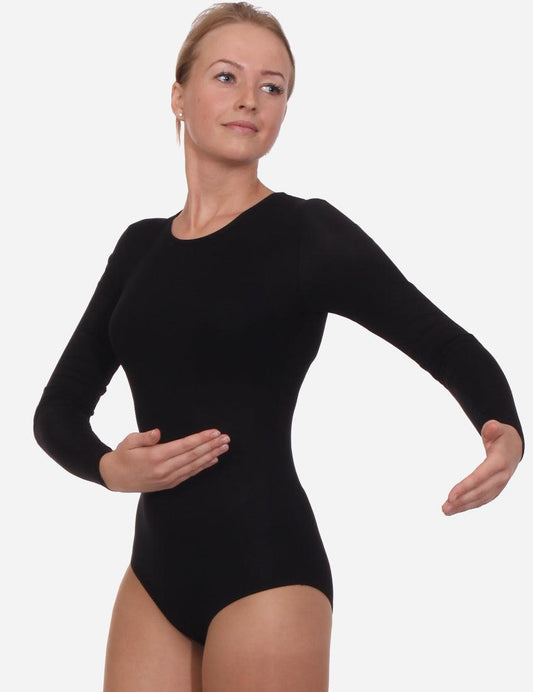 Confident female in a black leotard with a subtle neckline and full sleeves, poised for performance.