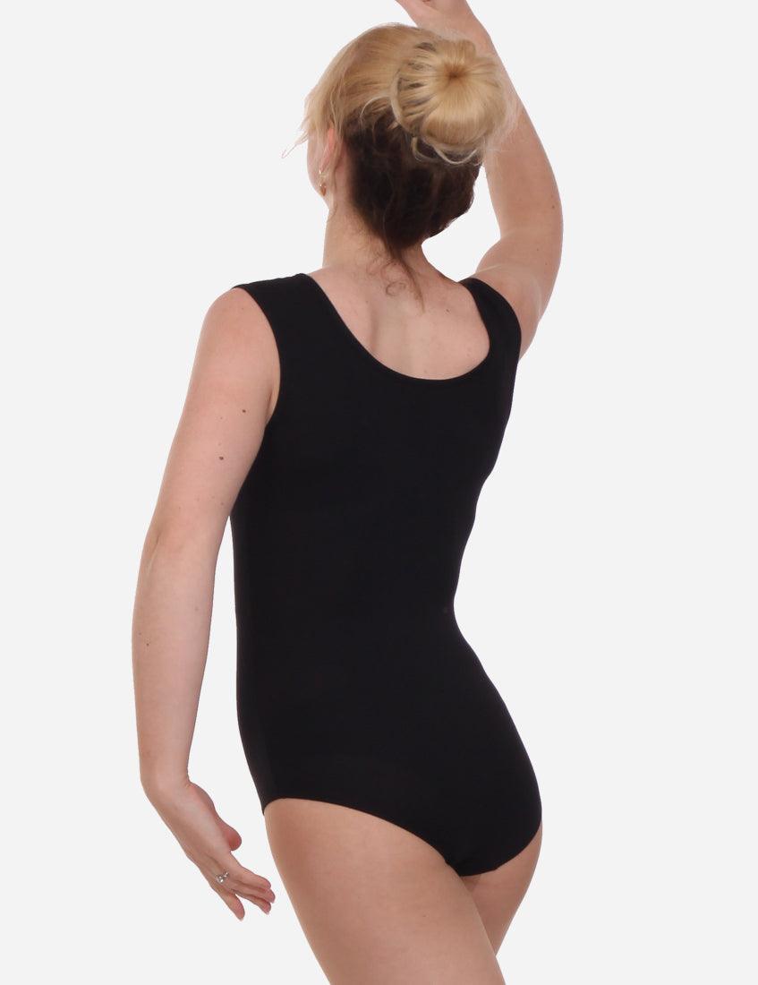 Rear view of a female dancer in a black sleeveless leotard with hair in a high bun, white background.