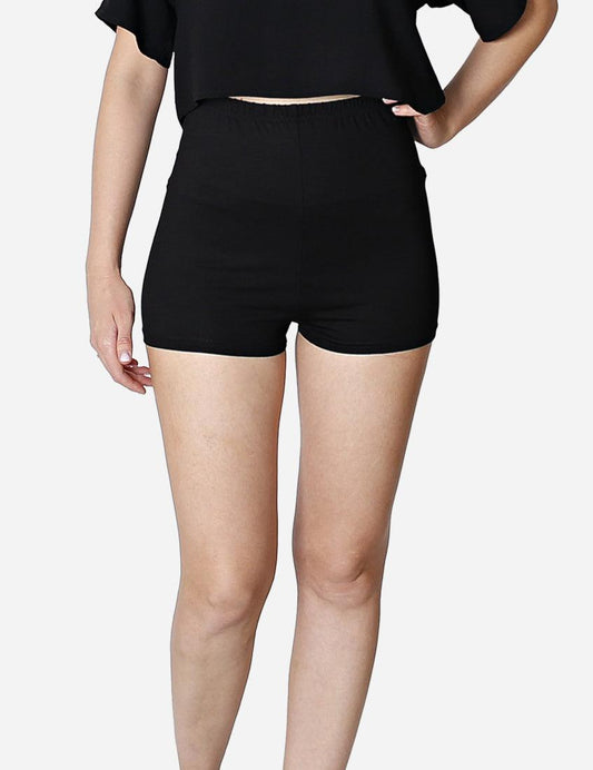 Side view of woman in high-waisted black yoga shorts paired with a casual black top.