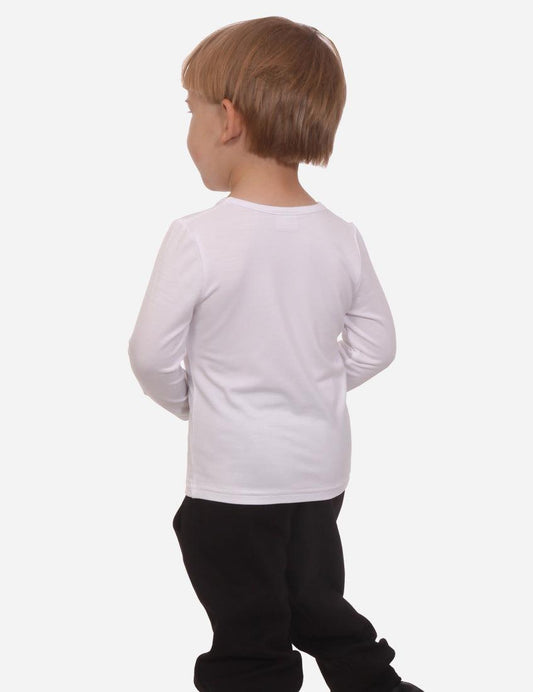 Back view of little boy in a white long sleeve shirt and black pants on white background