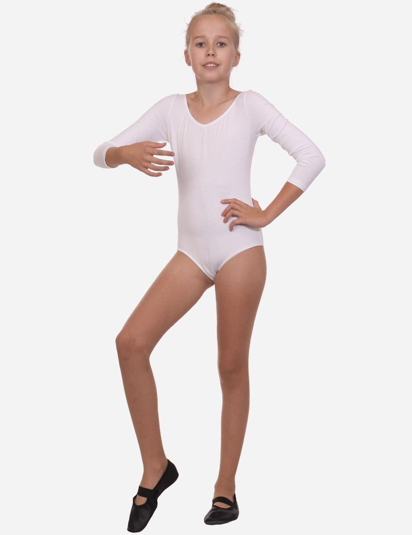 Full-length view of a young girl in a white leotard with half sleeves, standing confidently with ballet slippers.