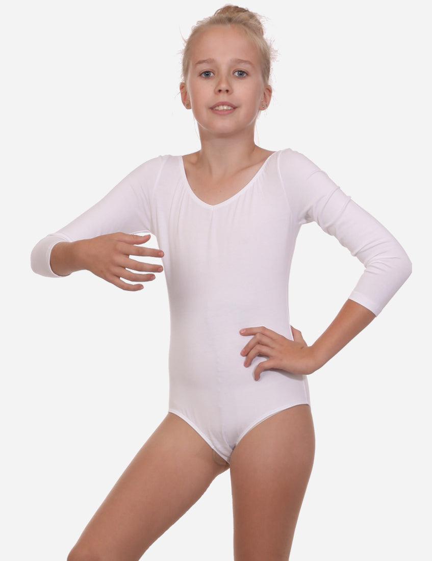 Young ballet dancer in a white leotard with half sleeves, posing with one hand on hip and the other extended.
