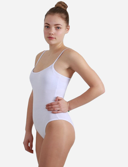 Woman facing forward in a white leotard with straps, displaying the leotard's neckline and her bun hairstyle.