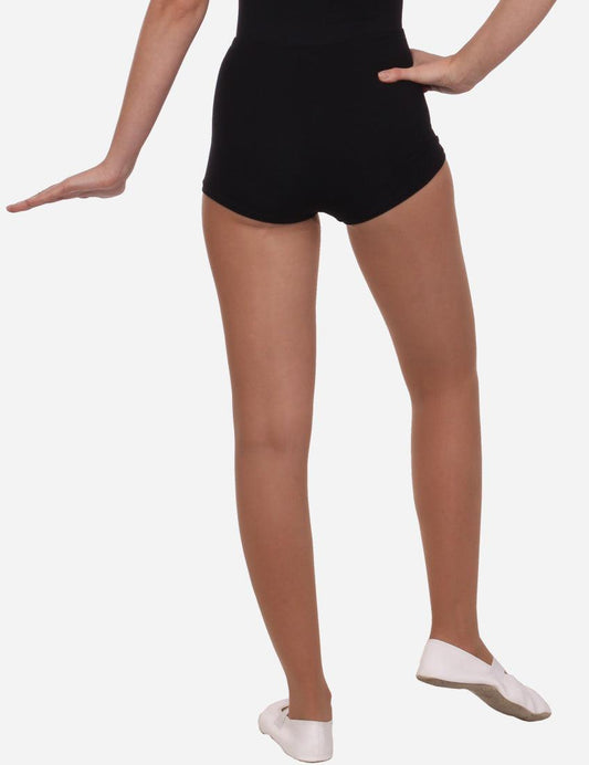 Rear view of a woman showcasing the back fit of black short elastic shorts.
