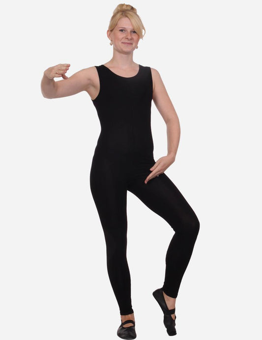 Woman in a black sleeveless unitard sportswear striking a pose with one hand on her hip.