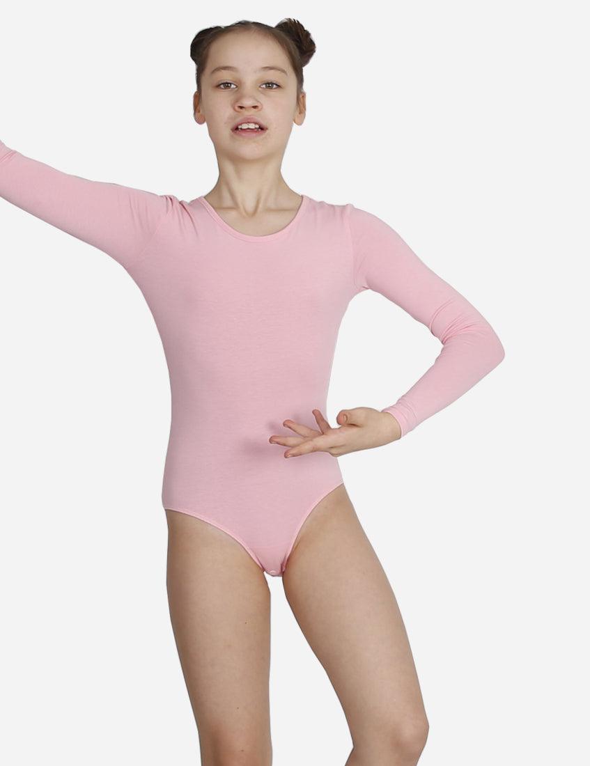 Young girl in a zippered pink leotard performing a ballet dance move