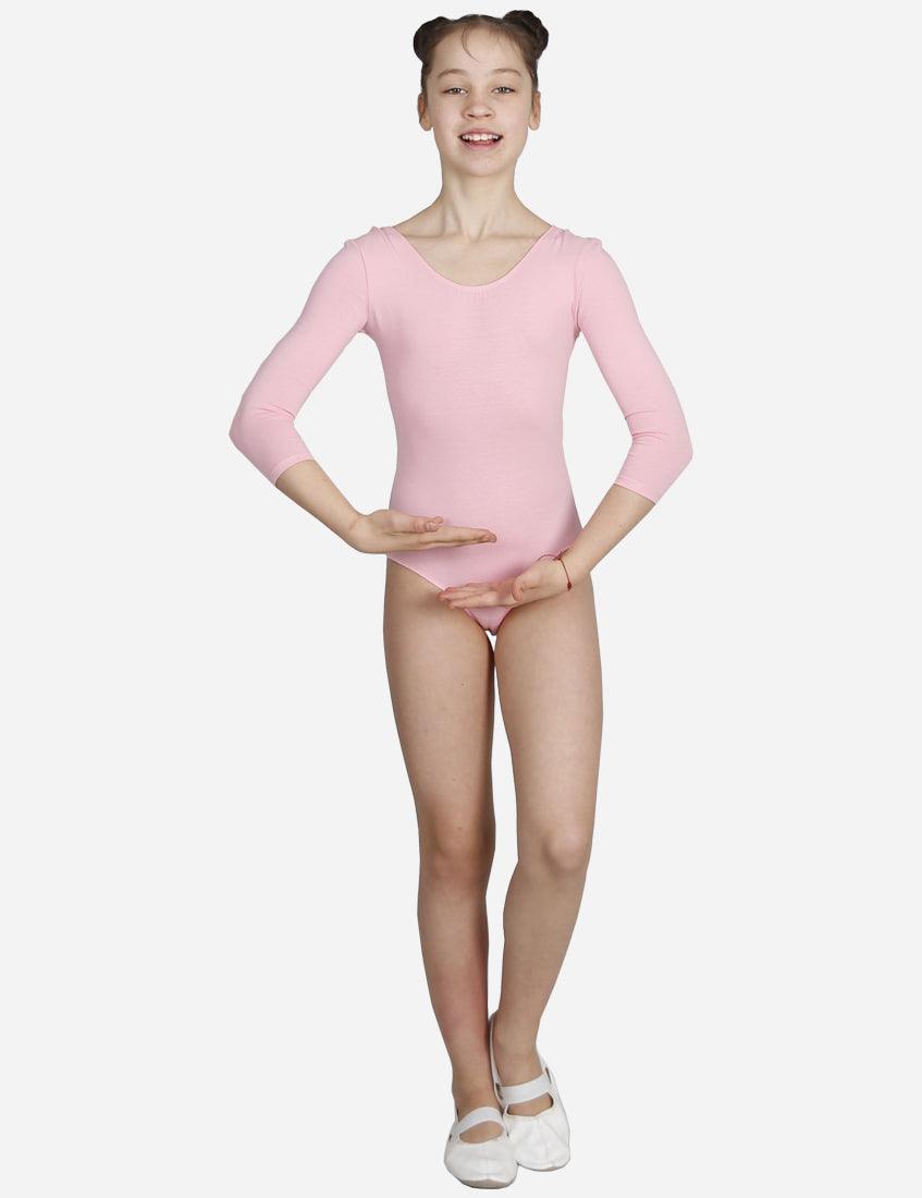 Young girl in pink three-quarter sleeve leotard presenting a ballet move